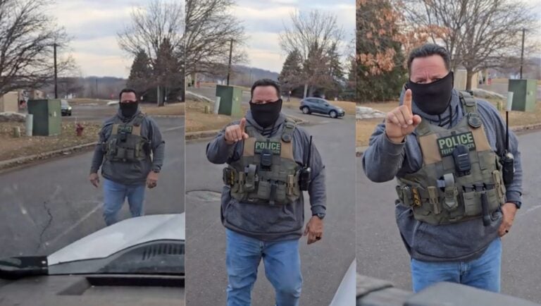 ICE agent speaking to a woman in Minnesota, moments before warning her, “Next time you’ll get arrested,” in a viral confrontation video.