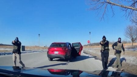 Dashcam video shows armed DHS agents surrounding an unarmed Minnesota woman inside her car.