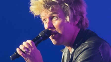 Billie Joe Armstrong addresses the crowd during a Green Day performance at a Super Bowl weekend event in California.