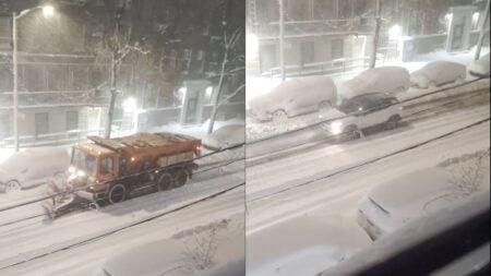 plow and SUV driving through bronx, new york during road ban