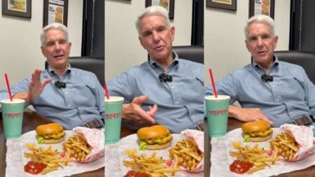Texas P. Terry's Burger Stand CEO Patrick Terry sitting down with a double cheeseburger, fries and strawberry shake during his viral burger war response video.