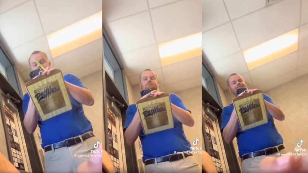 California Corcoran High School teacher Casey Snyder walking through a classroom appearing to secretly record students from above a cardboard.