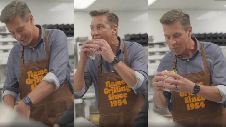 Burger King President Takes a Big Bite of a Whopper After McDonald’s CEO Timidly Bit Into New Big Arch Burger in Illinois: ‘This Is My Kind of Petty’ Burger King president Tom Curtis taking a big bite of a Whopper.