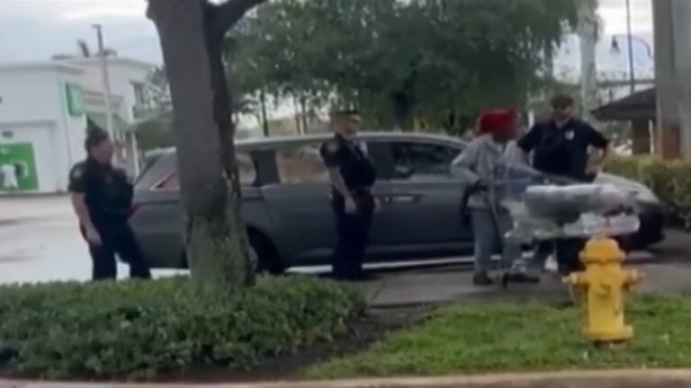 police escorting lady off property