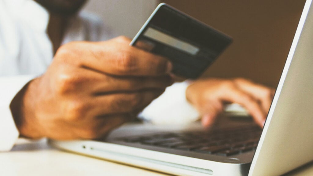 Man Holding Credit Card