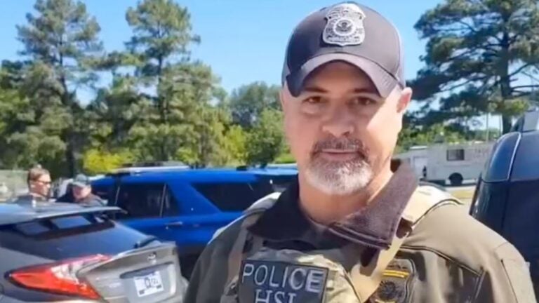 A street scene in Memphis Tennessee representing the viral video of an ICE agent confronting a U.S. citizen for legally filming federal agents in public.