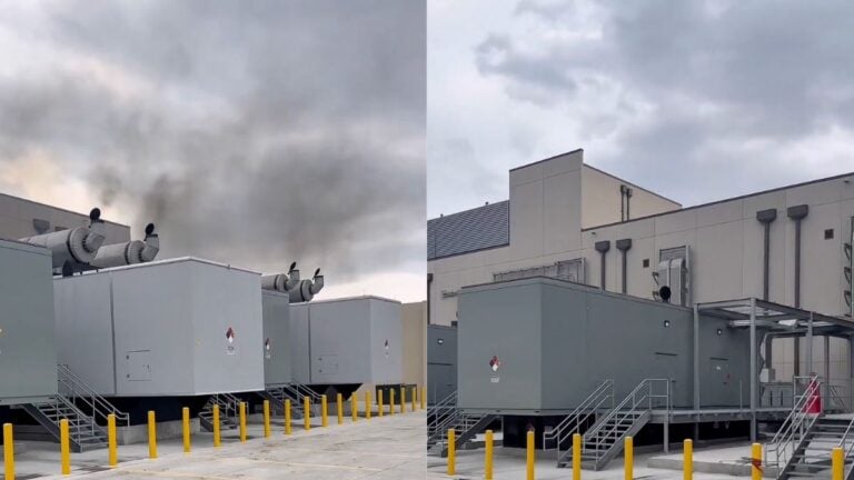 Multiple large gray container-style diesel backup generator units lined up on a concrete pad outside a Florida data center facility, with thick black smoke rising from exhaust stacks into a cloudy sky.