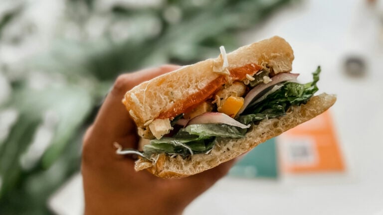 Breakfast Sandwich in Person's Hand
