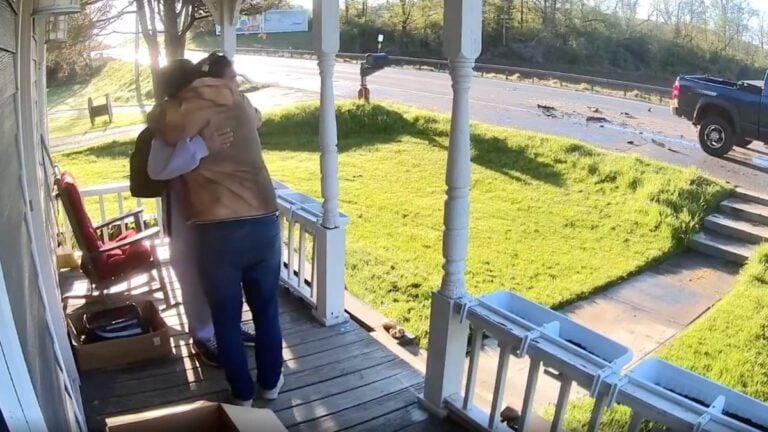 New York Dad Hugs Son After a Distracted Driver Slams Into His School Bus Outside Their Front Door: ‘Big Sigh of Relief’ Matthew Rutkowski embraces his son Jeremiah outside their home in Bouckville, New York, after a distracted pickup truck driver slammed into the back of Jeremiah's school bus on Route 20 in Madison County on May 7, 2026.