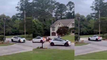 Multiple empty Waymo self-driving robotaxis are seen circling a residential cul-de-sac in the Buckhead neighborhood of northwest Atlanta, Georgia.