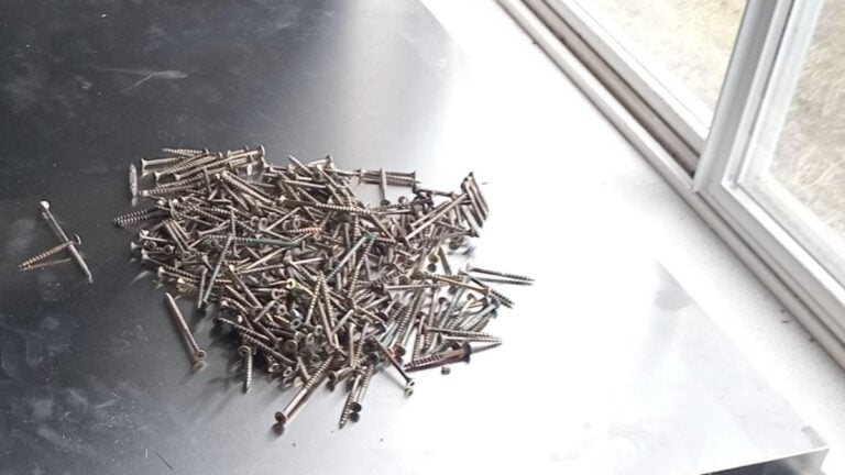 Minnesota Family Shocked to Find Yard Covered in Sharp Screws After Contractor Visit: ‘This Is Is Just Being Sloppy’ Pile of screws on metal table