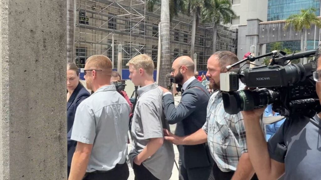 Outrage As Florida Teen Accused In 18-Year-Old Step Sister’s Death Walks Free As Judge Reviews Case: ‘Classic Example Of How Little Women Are Protected’ Timothy Hudson, 16, walks out of the James Lawrence King Federal Justice Building in Miami flanked by a public defender following a federal court hearing on May 27, 2026.