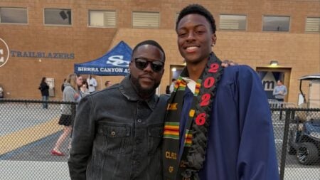 Kevin Hart and his son posing for a photo at the Sierra Canyon graduation ceremony.