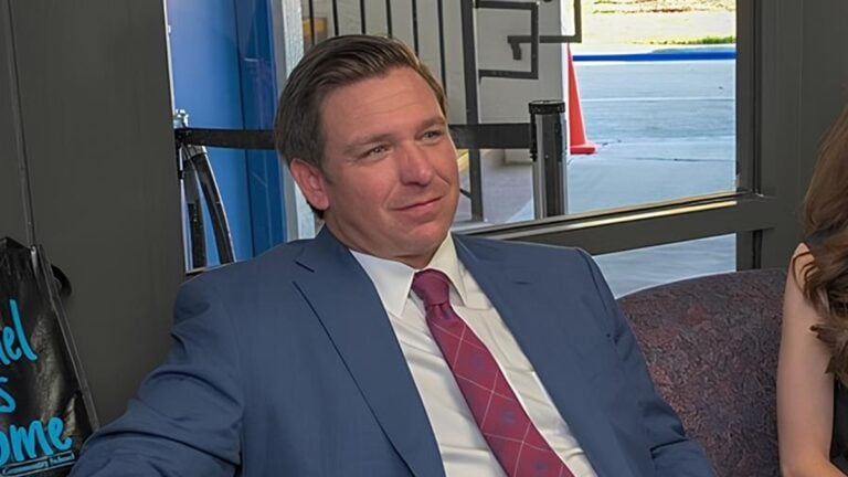 Florida Governor Ron DeSantis posing for a photo.