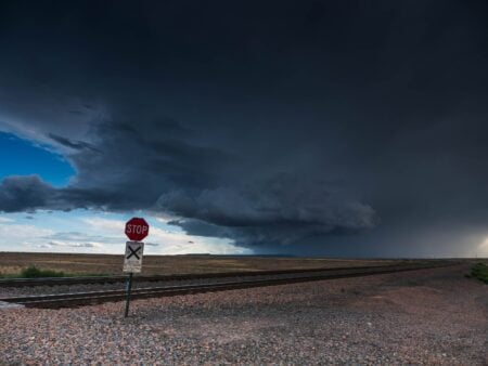 Storm clouds over road