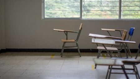 ‘Fire Her Immediately’: Texas Teacher Under Investigation For Discussing Lesbian Relationship With Students Empty classroom with several student desks arranged near large windows