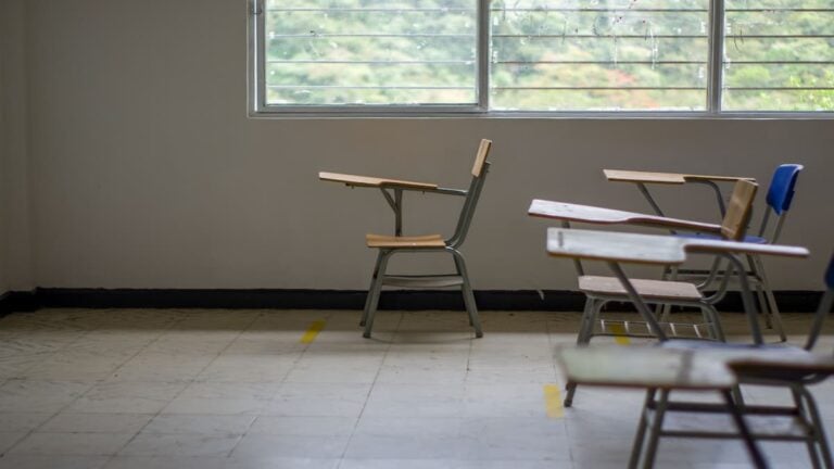 ‘Fire Her Immediately’: Texas Teacher Under Investigation For Discussing Lesbian Relationship With Students Empty classroom with several student desks arranged near large windows