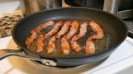 Cooking bacon on a skillet