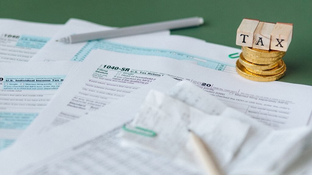 California Residents Angry After Lawmakers Approve New Taxes on Health Insurance and Software: ‘Even More Ways to Tax Us to Death’ A picture of tax sheets and pens.