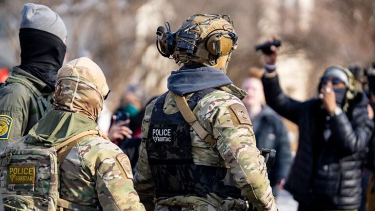 Federal agents ram a man's vehicle and demand identification at Park Avenue and 35th Street in Minneapolis on January 12, 2026.