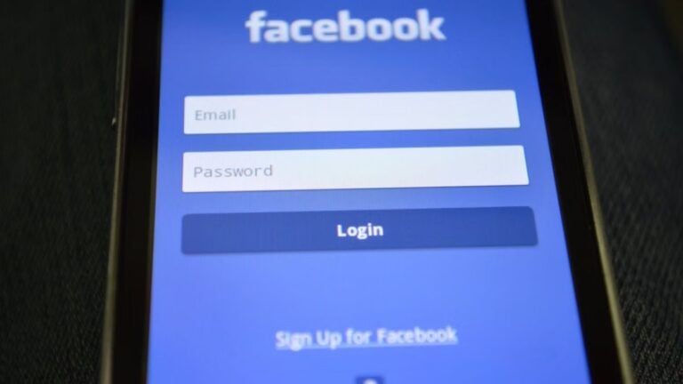 Close-up of a smartphone screen showing the Facebook login interface.