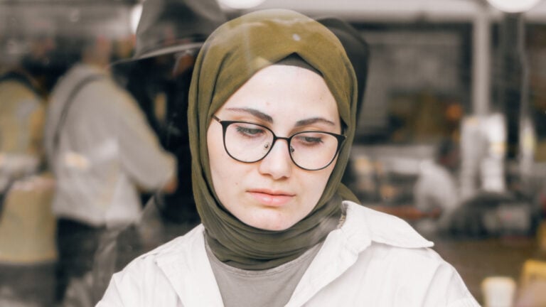 Woman with Glasses Wearing a Headscarf