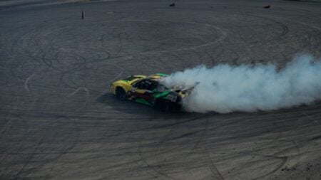 Dynamic drifting car creating smoke on track in Istanbul. Perfect for motorsport themes.