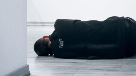 Man Sleeping on Floor