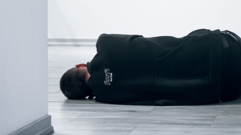 Man Sleeping on Floor