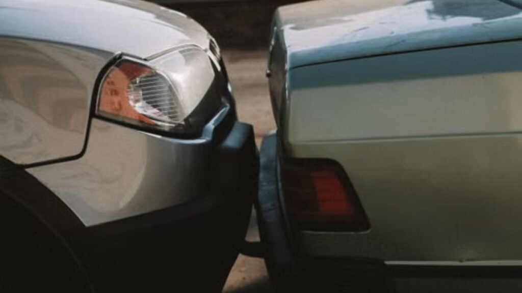 Illinois Woman Hits Another Car From Behind, Then Plays the Victim During Emotional Outburst: ‘You Hit Me’ A close-up view showing the aftermath of a rear-end car collision in an outdoor setting.