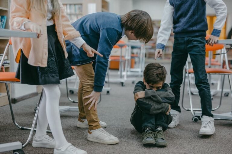 Ohio Mom Records Child Threatening Her Toddler: ‘And You Didn’t Say Anything’ A group of children in a classroom displaying bullying behavior.