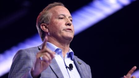 Texas Attorney General Ken Paxton speaking with attendees at the 2025 AmericaFest at the Phoenix Convention Center in Phoenix, Arizona.