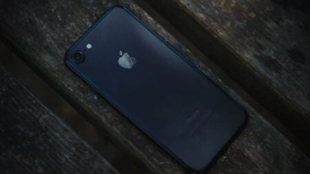 iPhone on wooded surface