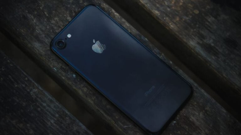 iPhone on wooded surface