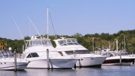 Florida Boat Flies Off Trailer at 70 MPH, Leaves Bystanders to Drag It Off the Road: ‘Only in Florida Would a Boating Accident Happen on Land’ Luxury yachts docked at a marina in Miami, Florida under a clear blue sky.