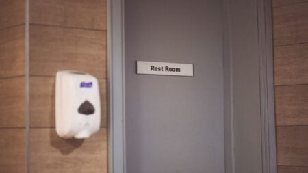 Outrage After Texas Man Is Found Inside Women’s Restroom While Young Girl Is Present: ‘He Walked Out Like He Owned the Place’ Image of a soap dispenser and a restroom door sign in a public restroom.