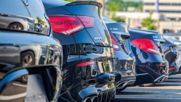 A row of parked cars in lot