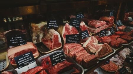 California Security Guard Stops Woman Allegedly Stealing Ribs, Sending Them Flying Across the Parking Lot: ‘She Wasn’t Ashamed’ A range of raw meat cuts on display in a butcher shop, featuring labels for each type.