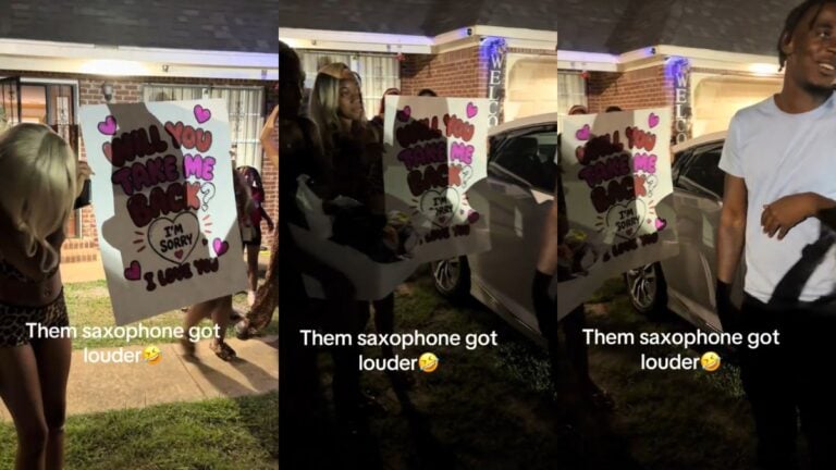 Woman holding a handmade "Will You Take Me Back" sign outside a house at night.