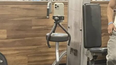 Gyms Have Gotten So Ridiculous That People Are Using Barbells as Tripods Now: ‘Just Use It With the Phone Hanging Off the End’ Gym Barbell Tripod Phone