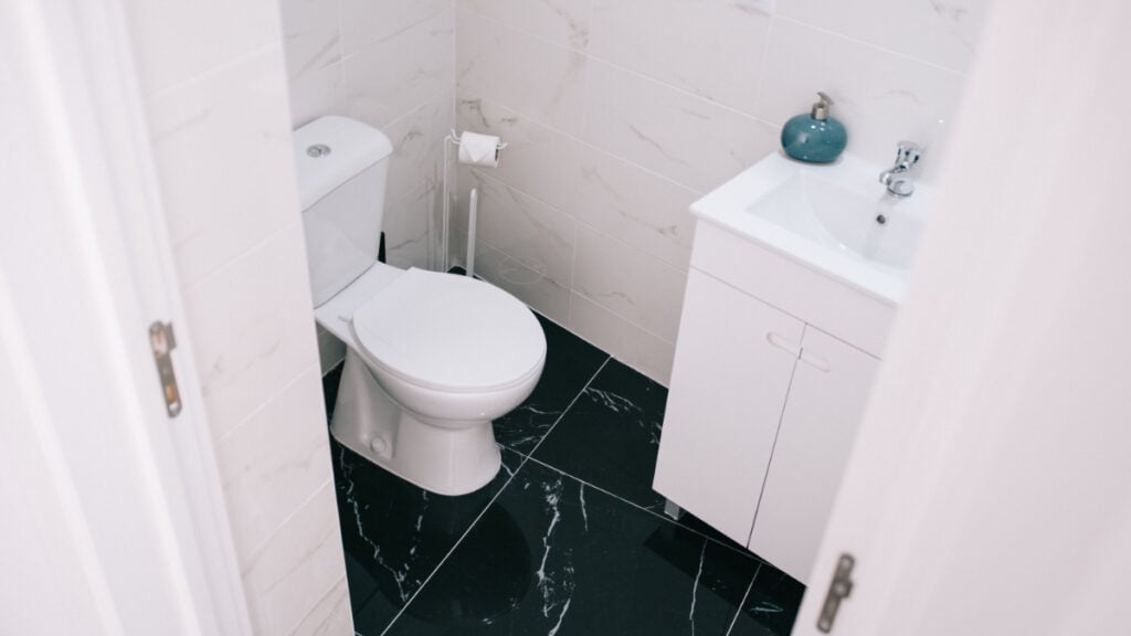 ‘It’s $0.30 a Day for Her to Use It’: Colorado Renter Says Landlord Is Charging Girlfriend to Use the Bathroom A contemporary bathroom showcasing a clean design with marble tiles and modern fixtures