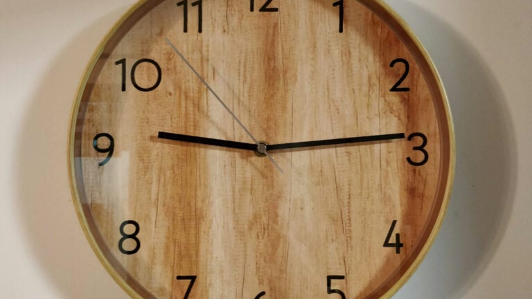 Brown wooden wall clock