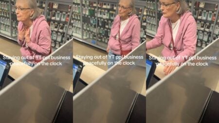 Woman stands in front of a store counter.