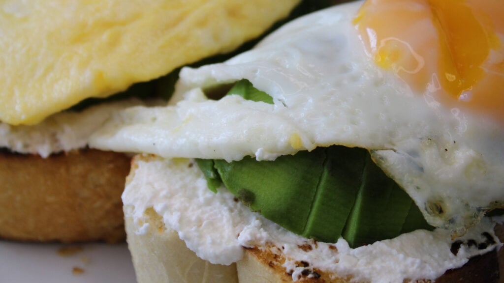 New Jersey Customer Spots $1.70 Charge to Remove Egg From Sandwich on Their Receipt: ‘What a Time to Be Alive’ Avocado toast topped with fried and scrambled eggs