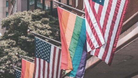 ‘We Can Regress if We Don’t Show Up’: Texas Volunteer Deputy Registrar Says Gay Coworker Refused Voter Registration Pride and USA Flags Hung Side by Side