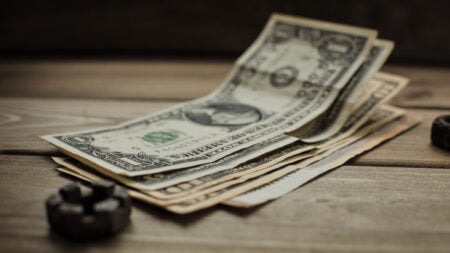 Oregon Diner Says Waitress Chased Them Down Sidewalk Over Tip Despite Receiving $40: ‘Doesn’t Care About Anything but Her Money’ Close-up of US dollar bills on a wooden table