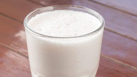 New Mexico Sonic Worker Says Customers Were Accidentally Served Ranch Milkshakes for an Entire Night, but ‘Nobody Complained’ vanilla milkshake served in a tall glass on a wooden table