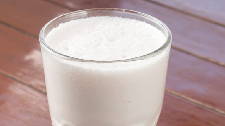 New Mexico Sonic Worker Says Customers Were Accidentally Served Ranch Milkshakes for an Entire Night, but ‘Nobody Complained’ vanilla milkshake served in a tall glass on a wooden table