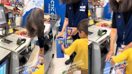 Walmart worker scans items.