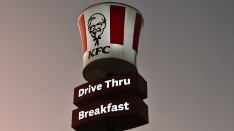 Racist North Carolina Man Loses It Over Delayed KFC Order, Hurls Slurs at Minor and Waits to Beat Him: ‘Sounds Like a MAGAt’ KFC drive-thru sign under a half moon at twilight in Midrand, South Africa.